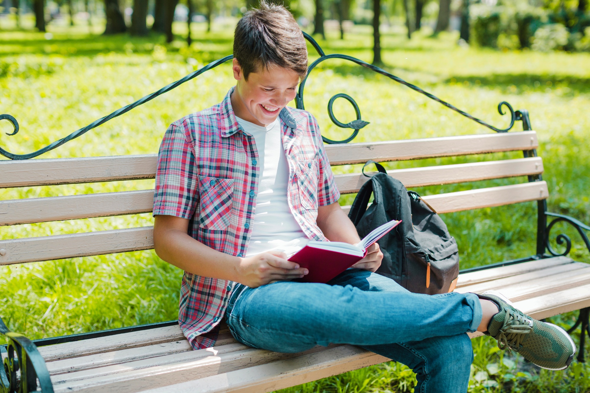https://175main.com/wp-content/uploads/2024/02/young-cheerful-man-reading-book-park.jpg